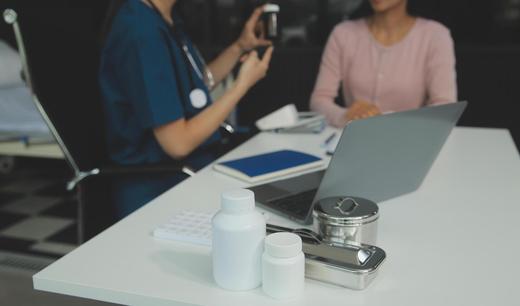 Doctor and patient discussing something while sitting at the table . Medicine and health care concept. Doctor and patient photo