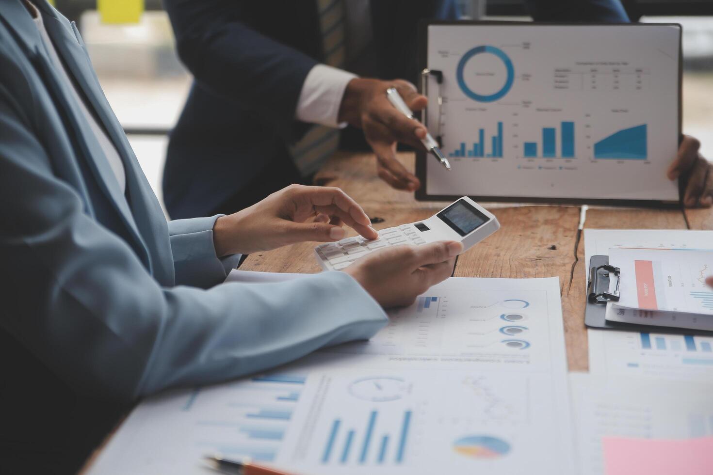 Co working conference, Business team meeting present, investor colleagues discussing new plan financial graph data on office table with laptop and digital tablet, Finance, accounting, investment. photo