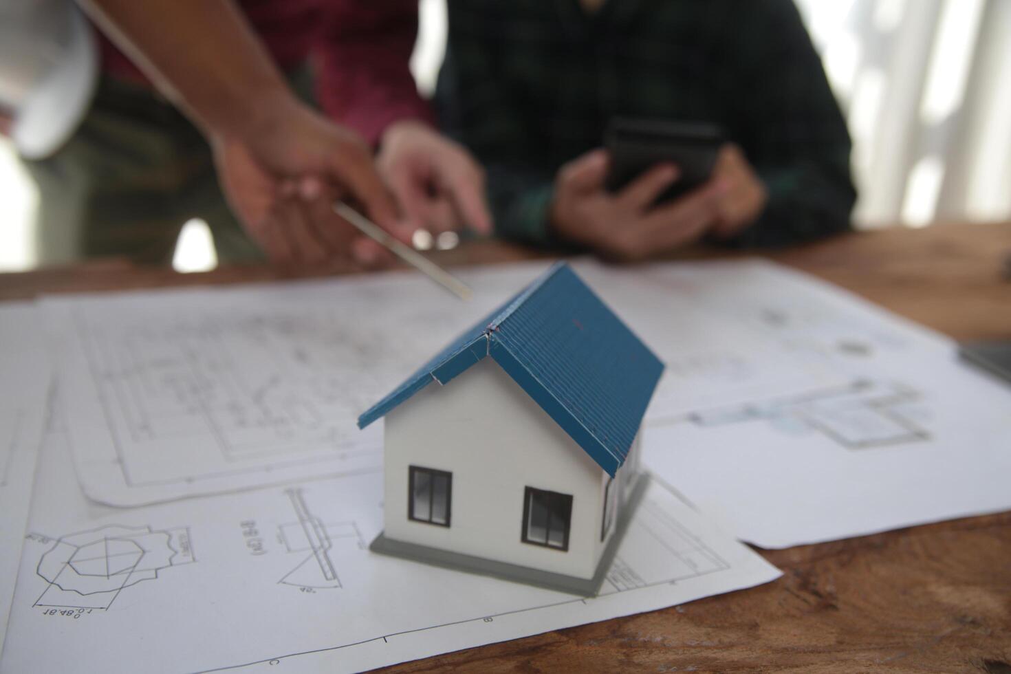 Diverse Team of Specialists Use Laptop on Construction Site. Real Estate Building Project with Engineer Investor and Businessman Checking Area, working on Civil Engineering, Discussing Strategy Plan photo