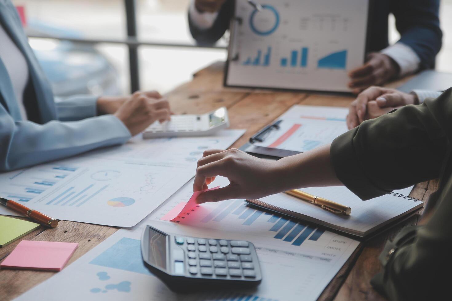 Co working conference, Business team meeting present, investor colleagues discussing new plan financial graph data on office table with laptop and digital tablet, Finance, accounting, investment. photo