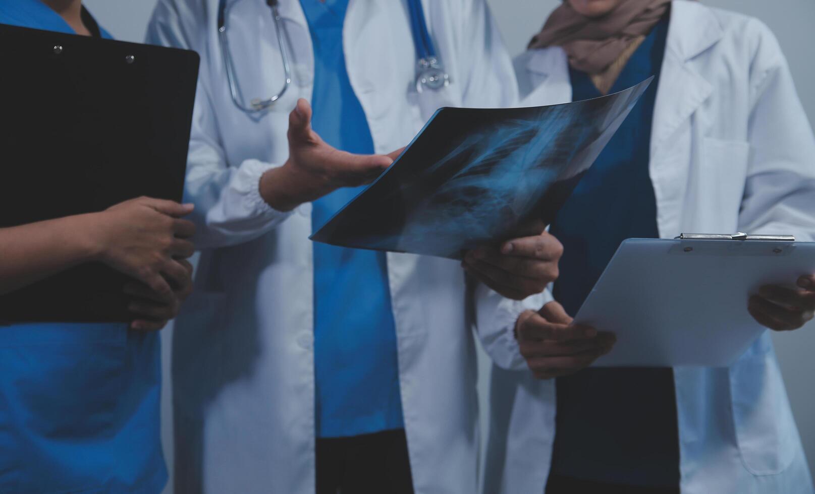 Quality healthcare is all about putting the patient at the centre. Shot of a group of medical practitioners having a discussion in a hospital. photo