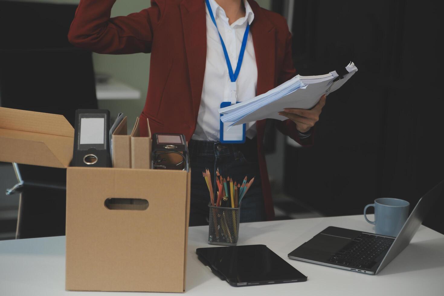 Businesswoman packing her things for move photo