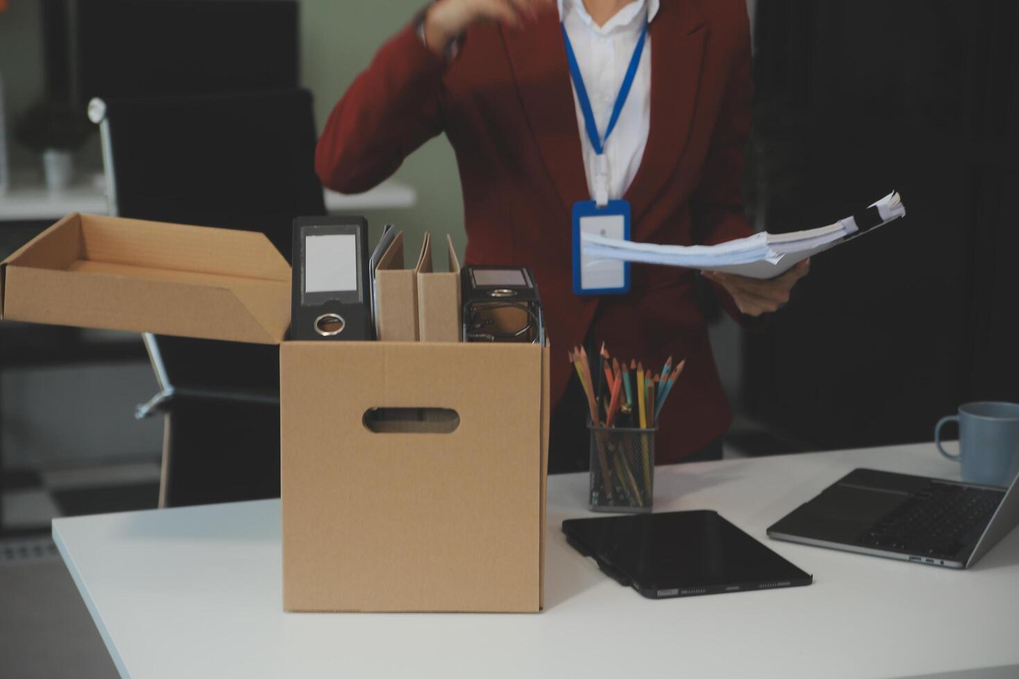 Businesswoman packing her things for move photo