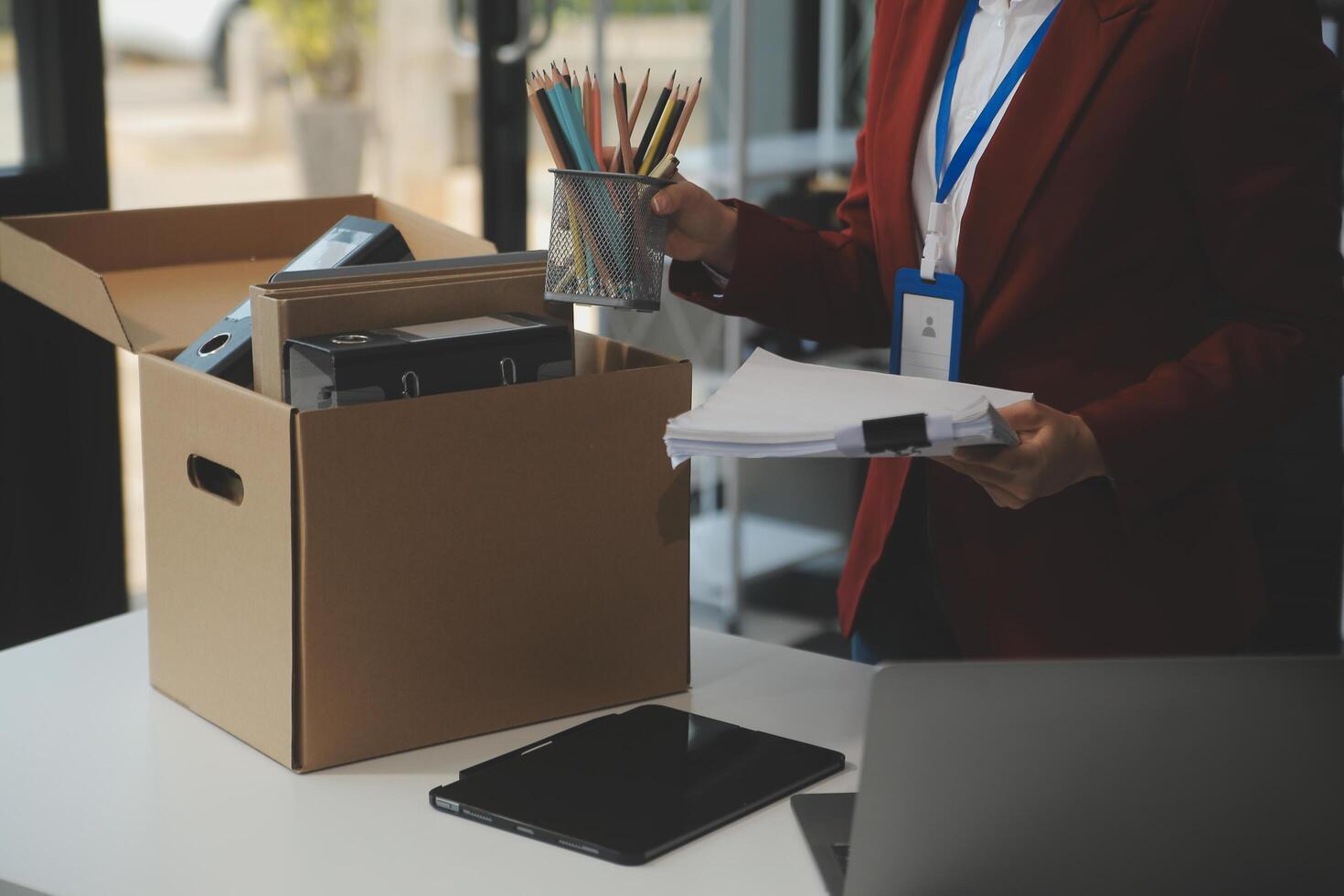Businesswoman packing her things for move photo