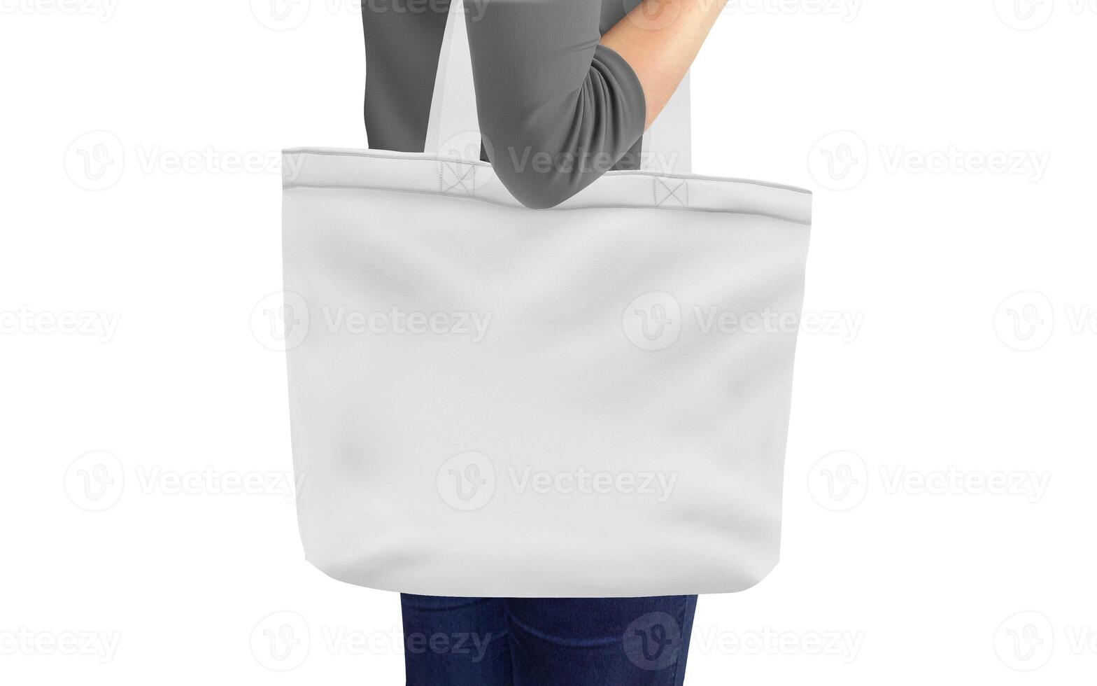 woman holding a tote bag on white background photo