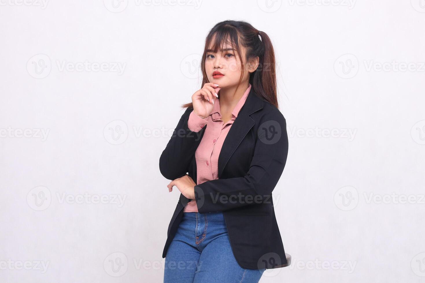 Beautiful happy Asian office woman in her 20s smiling wearing suit shirt casual working professionally tilted right holding chin on white background studio portrait for banner ad, banner, billboard photo