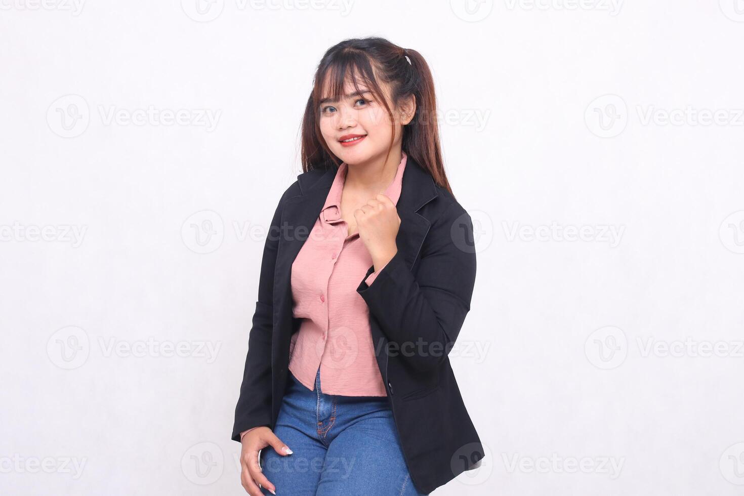 Beautiful happy asian office woman in her 20s thin smile wearing suit shirt working professionally clenching fist on white color background studio portrait for banner ad, banner, billboard photo