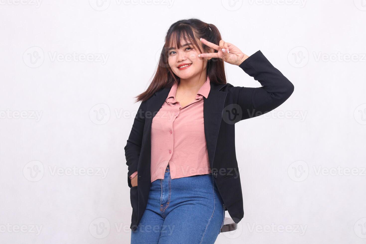 Beautiful Asian businesswoman in suit standing smiling hand pointing number 2 up white background studio portrait for advertising materials, banners, billboards, job vacancies, business opportunities photo