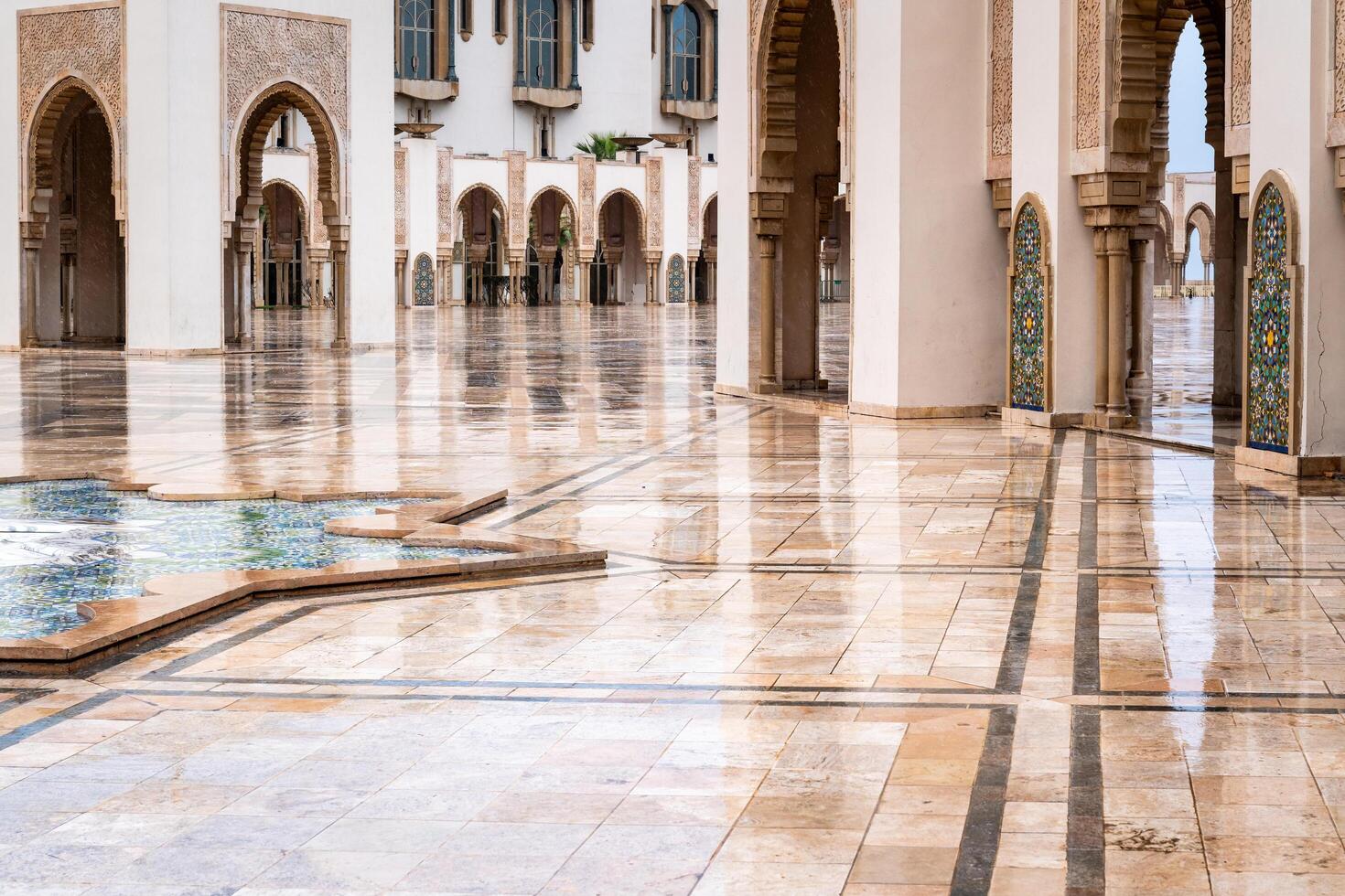 Casablanca, Morocco -march 25, 2024-view of the famous Hassan Second Mosque during a rainy day photo