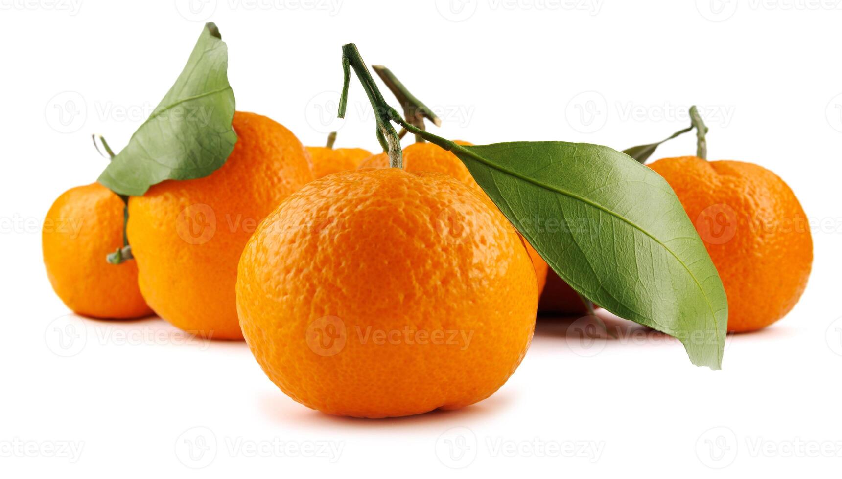 Several ripe tangerines isolated on a white background. Organic tangerine with green leaf. Mandarin. photo