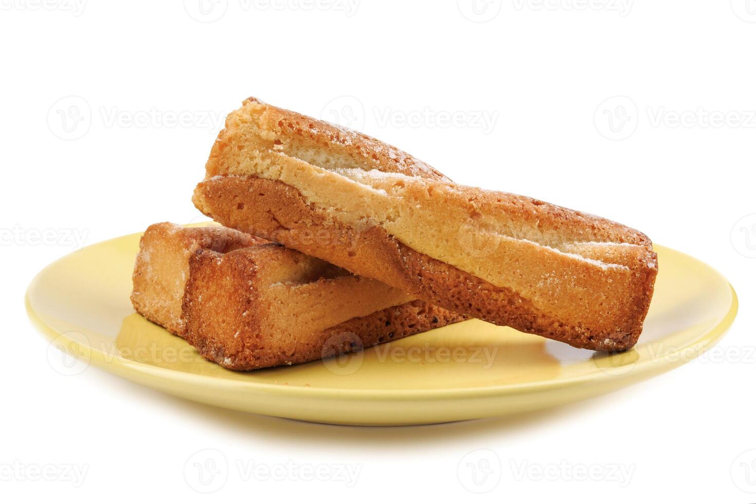 Several delicious crispy cookies lying on a yellow plate isolated on a white background. photo