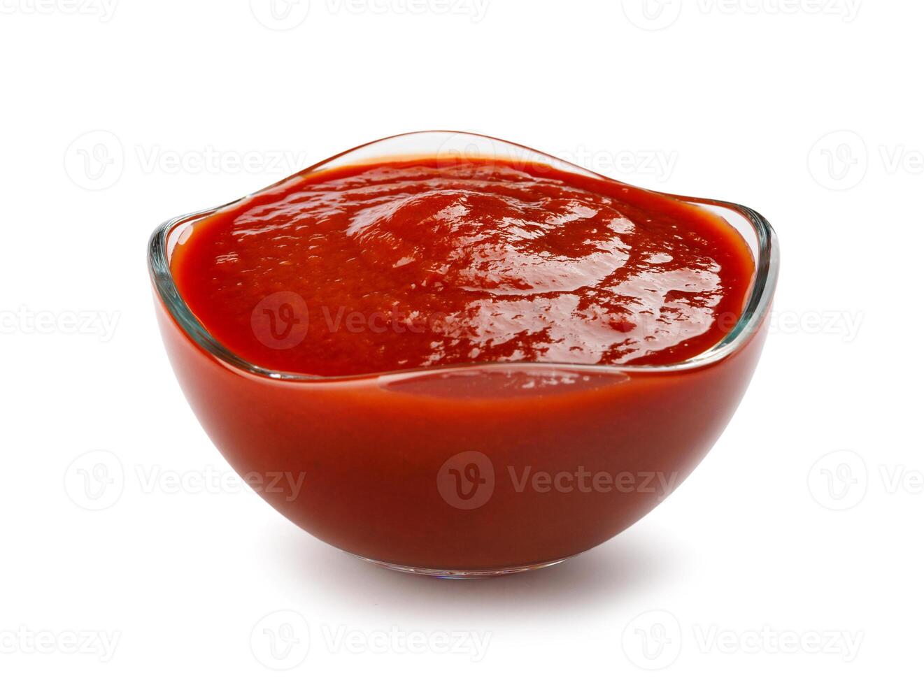 Ketchup in a glass cup isolated on a white background. Tomato sauce . photo