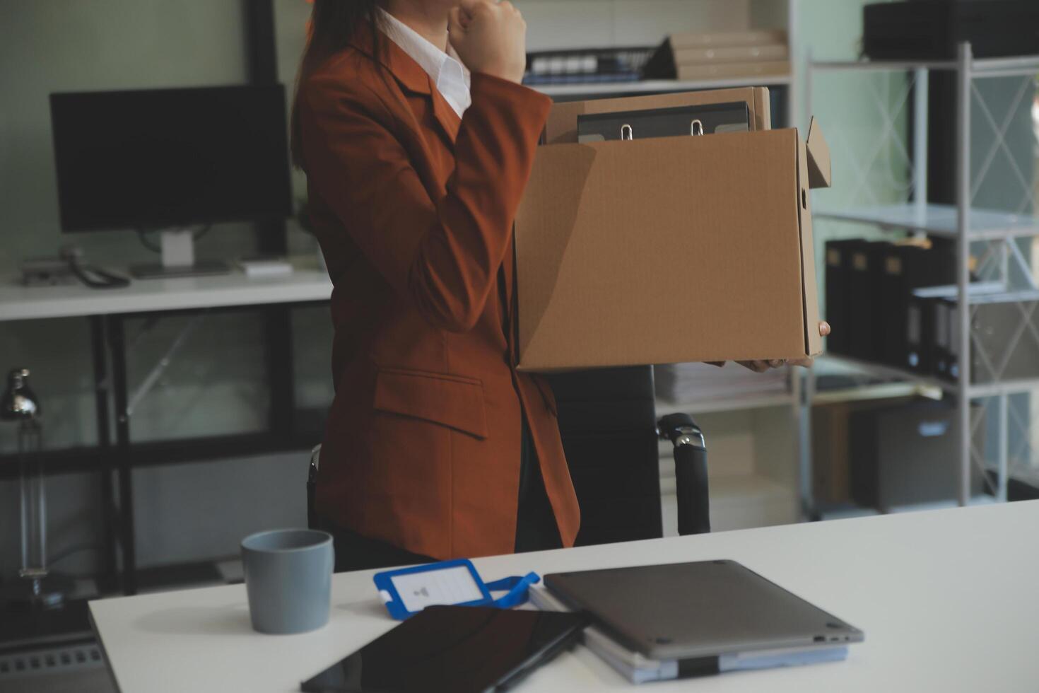 Businesswoman packing her things for move photo