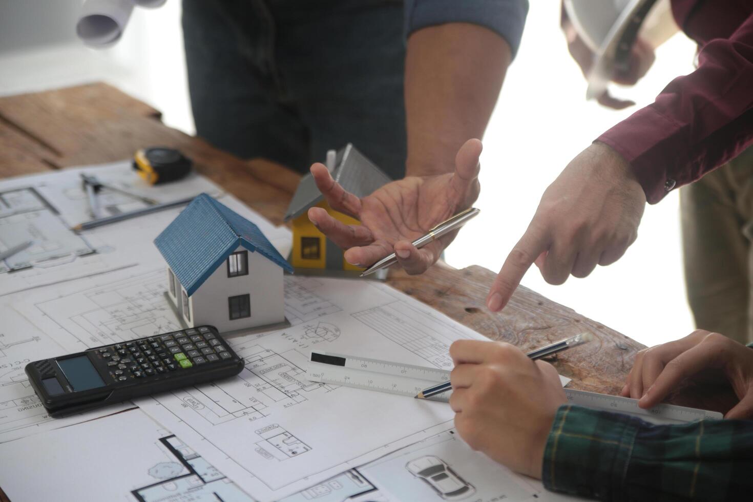 Diverse Team of Specialists Use Laptop on Construction Site. Real Estate Building Project with Engineer Investor and Businessman Checking Area, working on Civil Engineering, Discussing Strategy Plan photo