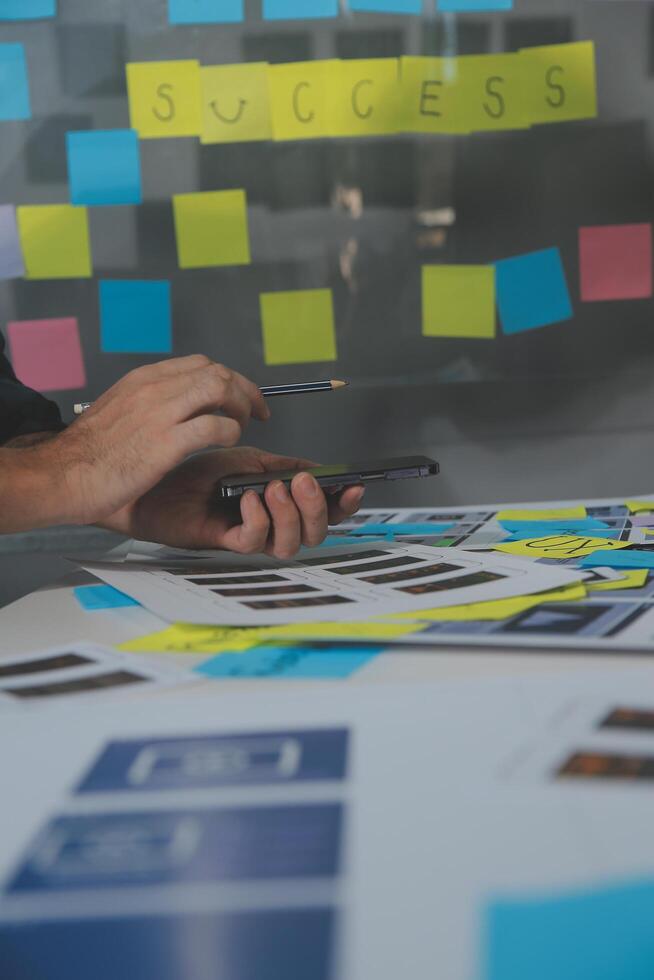 ux Graphic designer creative sketch planning application process development prototype wireframe for web mobile phone . User experience concept. photo
