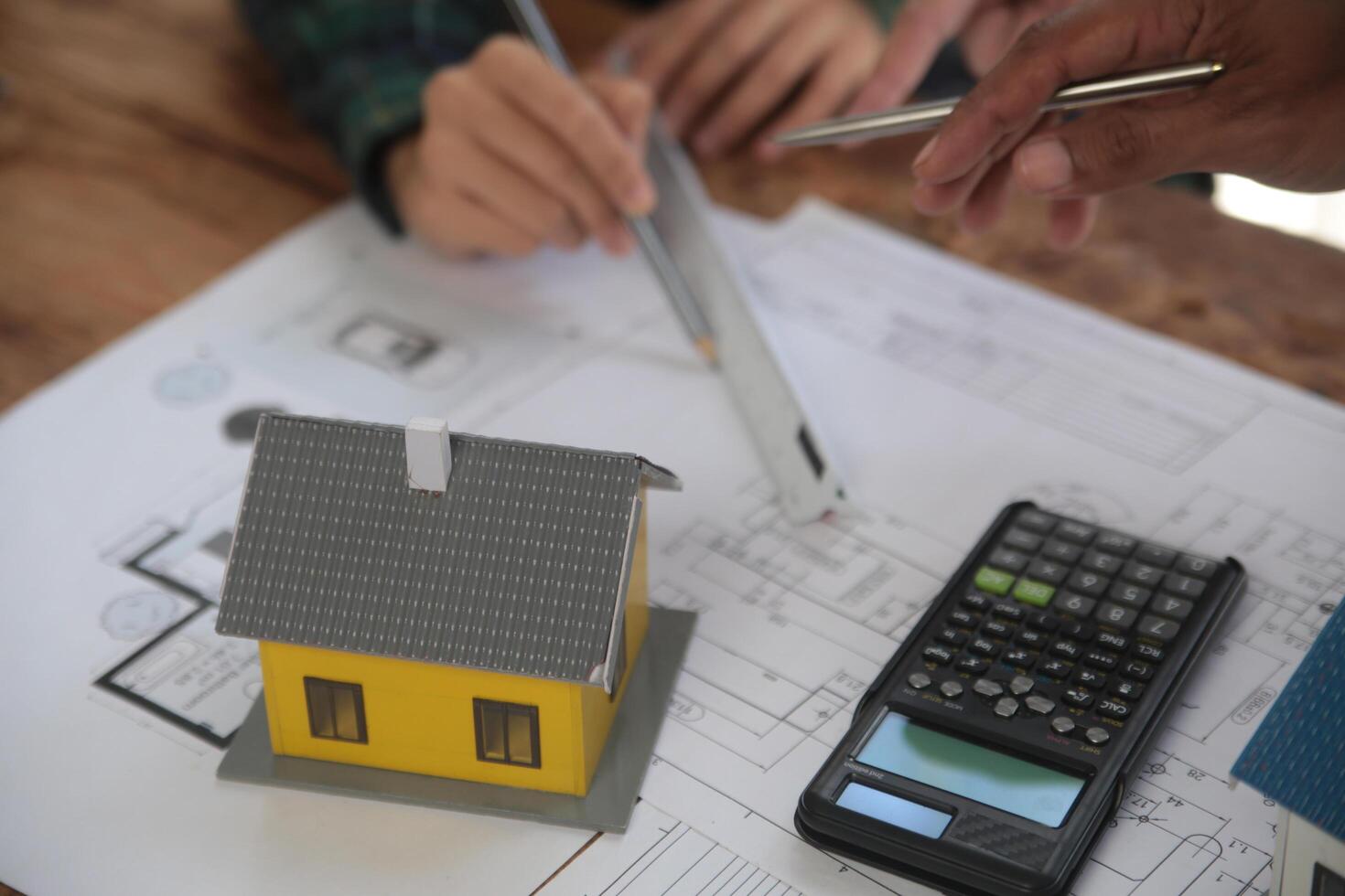 Diverse Team of Specialists Use Laptop on Construction Site. Real Estate Building Project with Engineer Investor and Businessman Checking Area, working on Civil Engineering, Discussing Strategy Plan photo