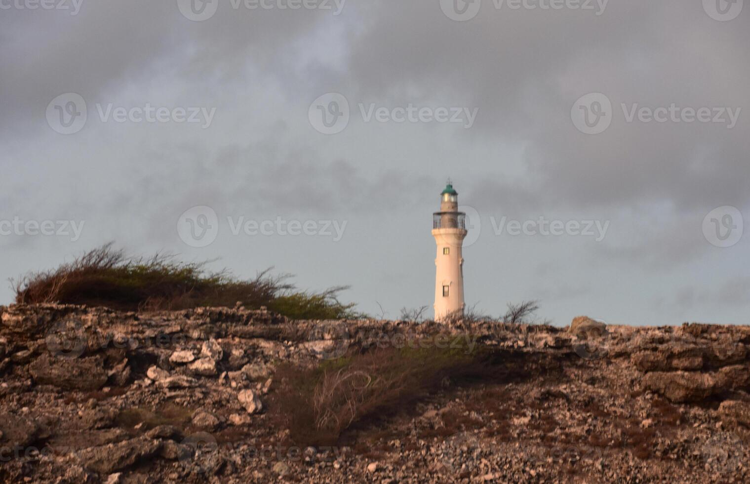 Arid Rugged Landscape with California Lighthouse in the Background photo