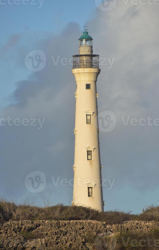 Rugged Landscape Surrounding a Lighthouse photo