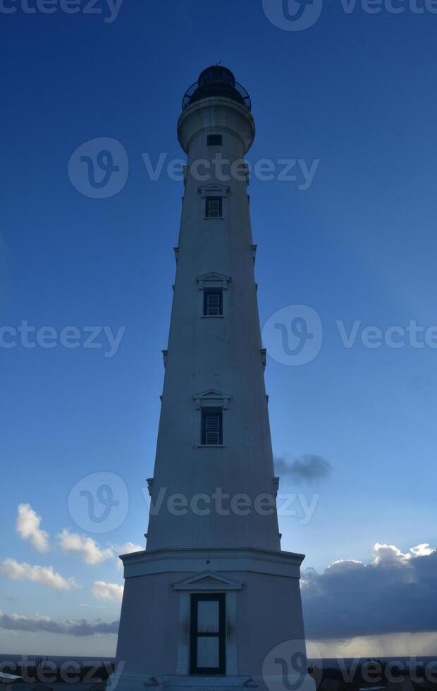 Imposing Lighthouse Rising up the Blue Skies photo