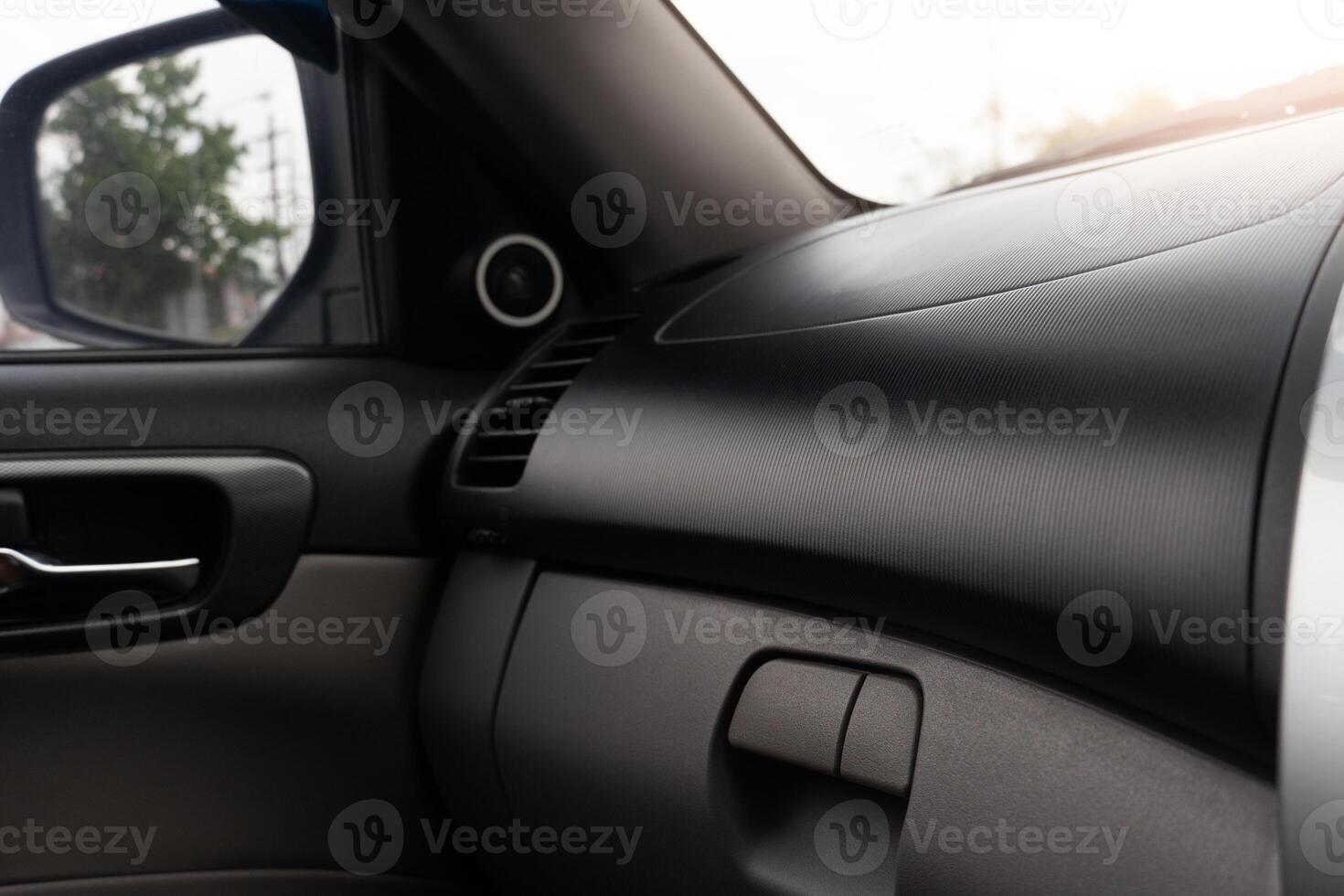 Modern car interior drawer in front of passenger. View from inside the car with body car dark tone. photo