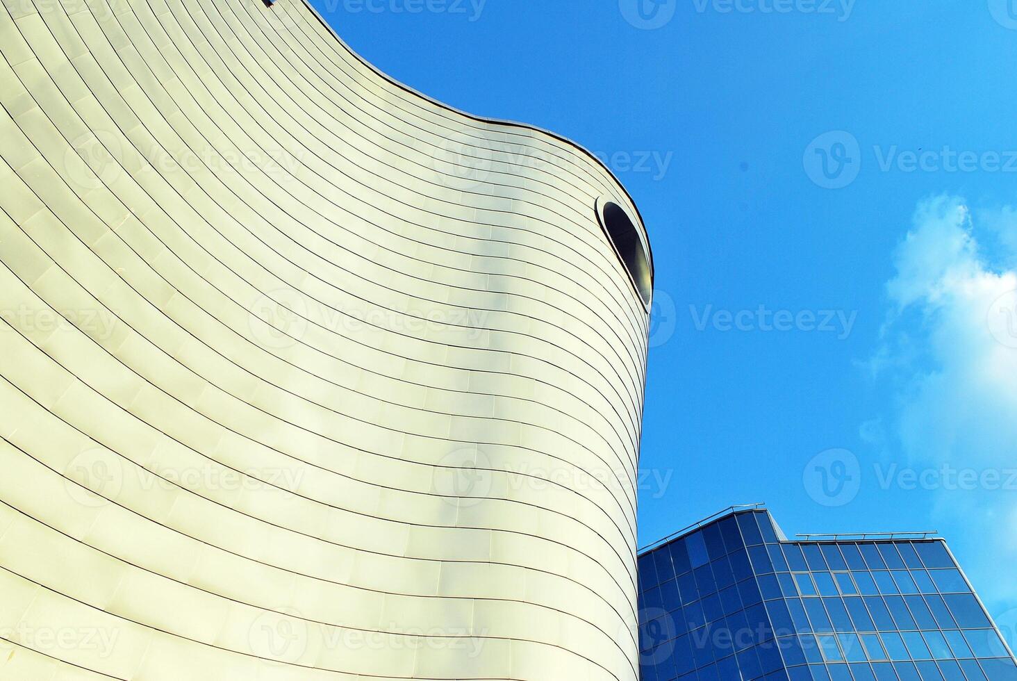 Modern office building in the city with windows and steel and aluminum panels wall. photo