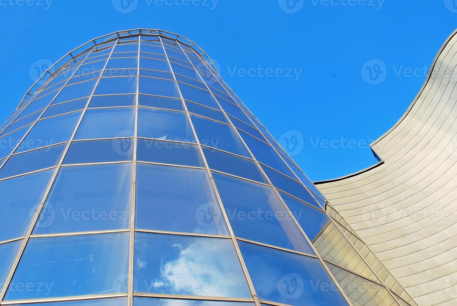 Modern office building in the city with windows and steel and aluminum panels wall. photo