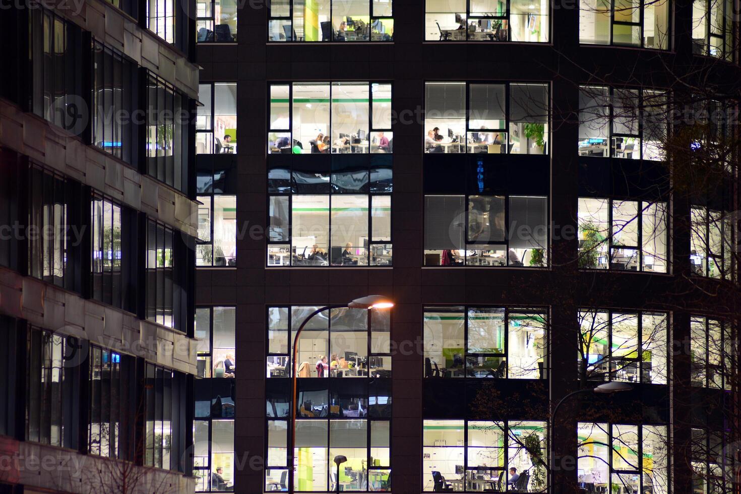 Modern office building at night. Night lights, city office building downtown, cityscape view photo
