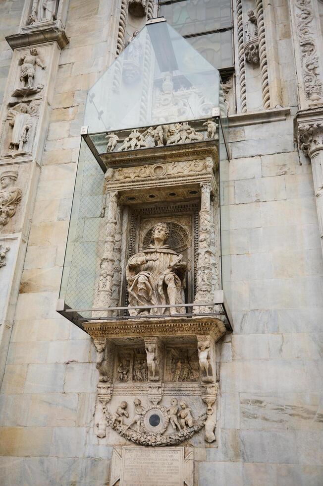 Exterior of the Cathedral in Como city, with Italian architectural details, sculpture, stone carvings. Lombardy. Italy photo