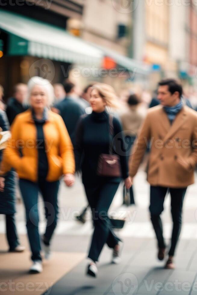 Defocused people walking in the street in motion blur photo