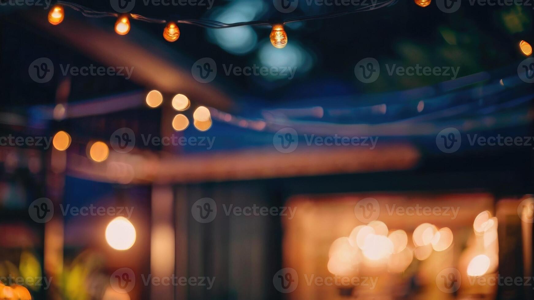 DDefocused restaurant with outdoor string lights on a blurred background photo