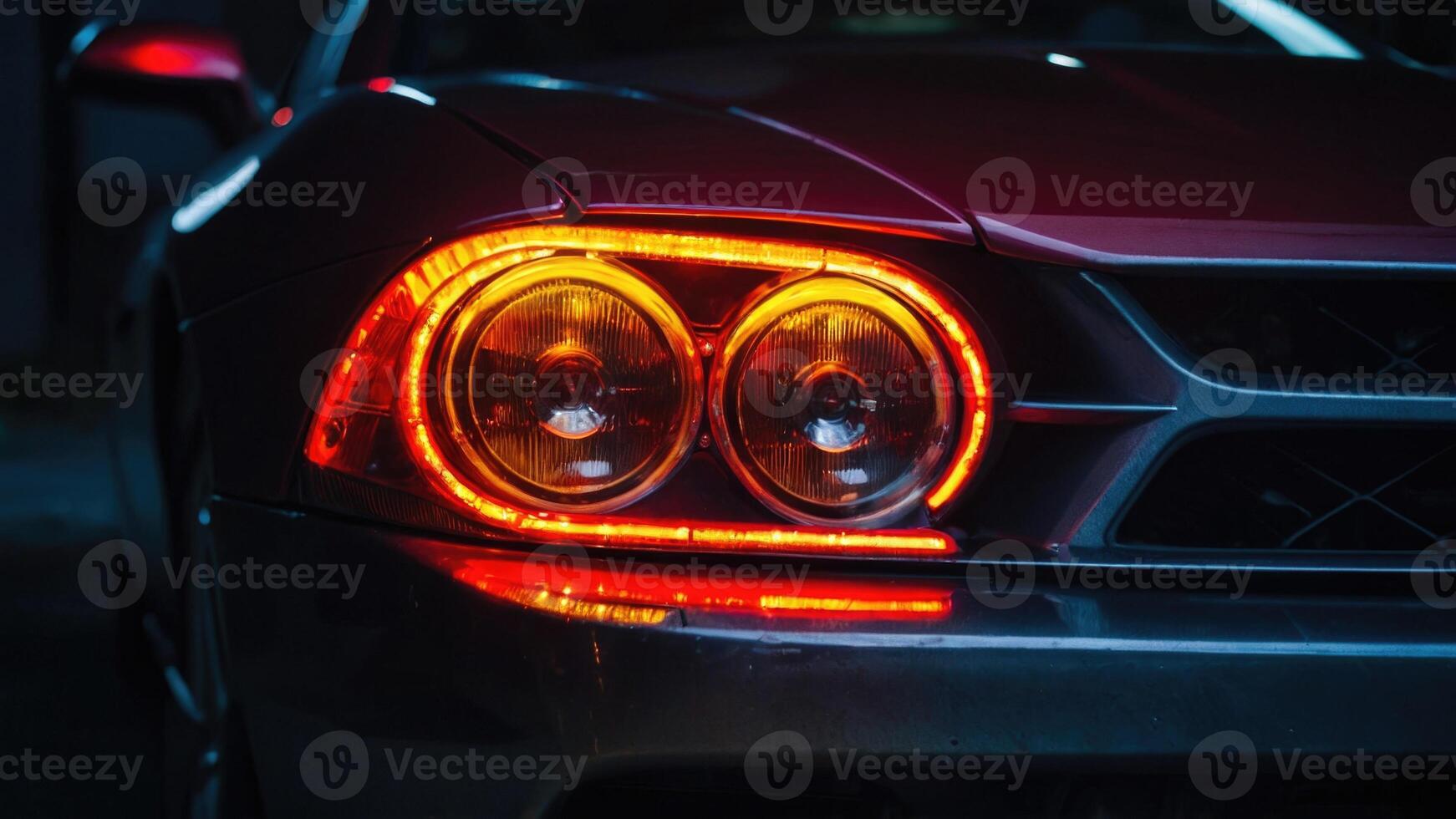 a close up of the tail light of a sports car photo