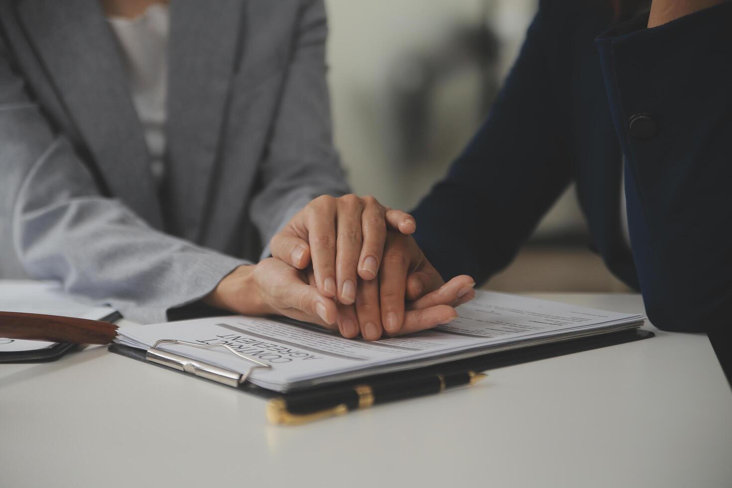 Lawyer, legal advisor, businessman brainstorming information on agreement details Business contracts in legal processing books for accuracy in contract documents. joint financial investment. photo