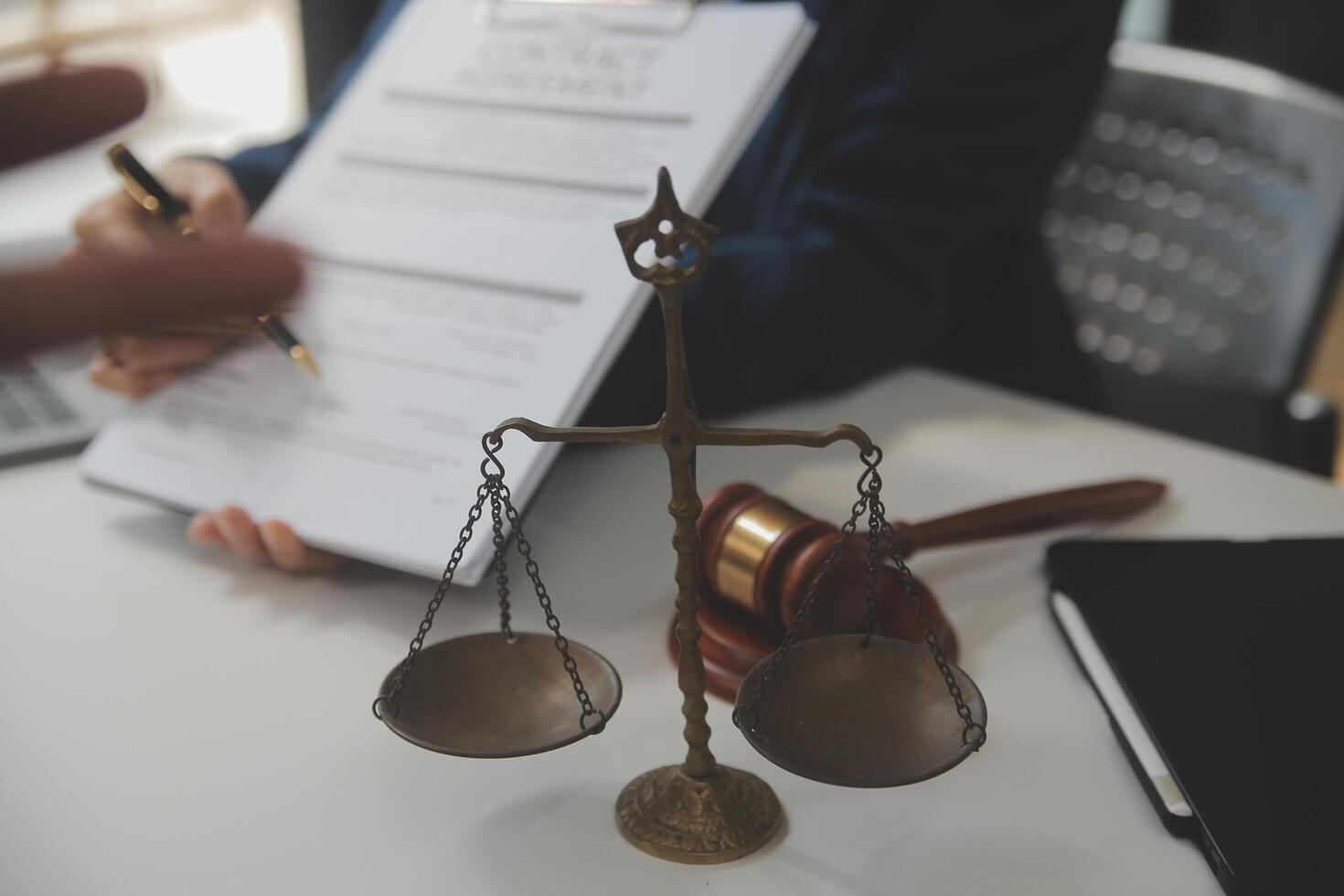 Lawyer, legal advisor, businessman brainstorming information on agreement details Business contracts in legal processing books for accuracy in contract documents. joint financial investment. photo