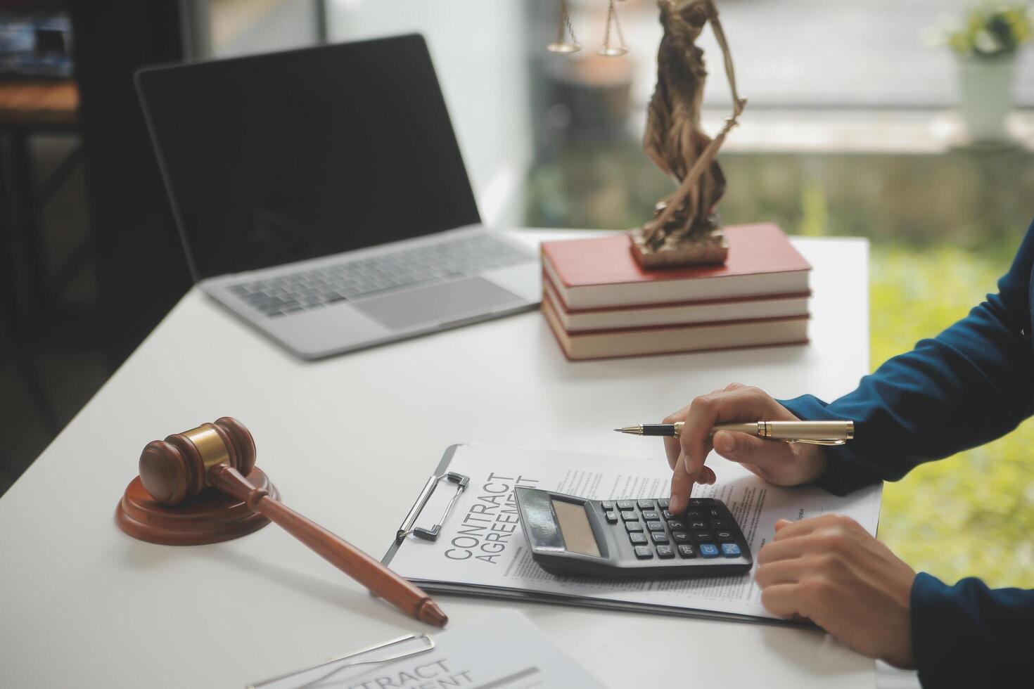 Lawyer, legal advisor, businessman brainstorming information on agreement details Business contracts in legal processing books for accuracy in contract documents. joint financial investment. photo