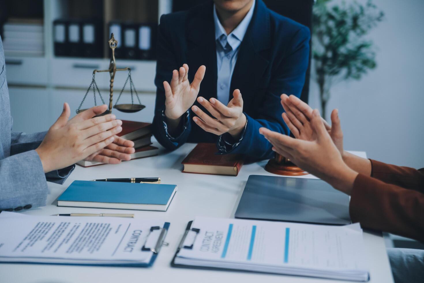 Business people clapping and applause at meeting or conference, close-up of hands. Group of unknown businessmen and women in modern white office. Success teamwork or corporate coaching concept photo