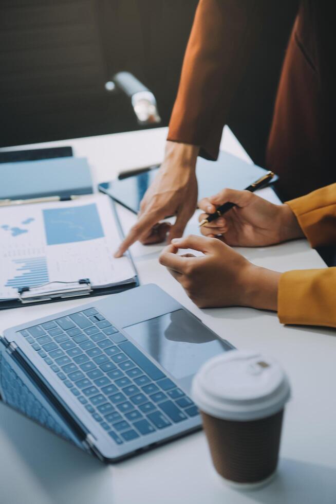 Financial Business team present. Business man hands hold documents with financial statistic stock photo, discussion, and analysis report data the charts and graphs. Finance Financial concept photo