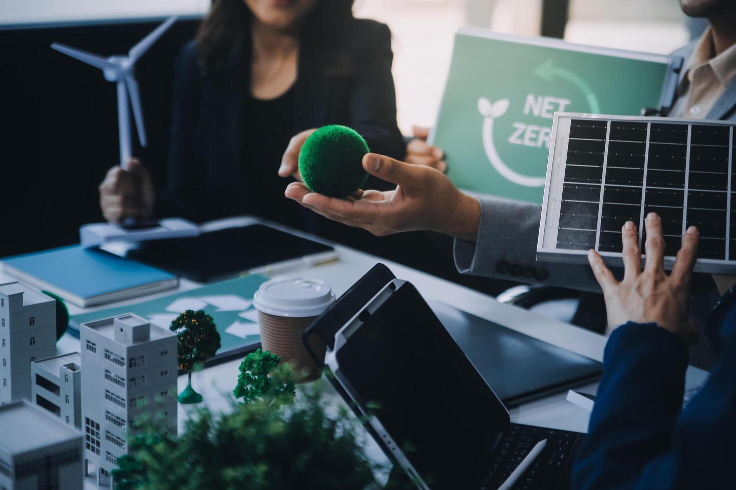 Green energy business company meeting with business people planning and discuss marketing of sustainable and renewable clean energy product with solar cell and wind turbine generator. Trailblazing photo