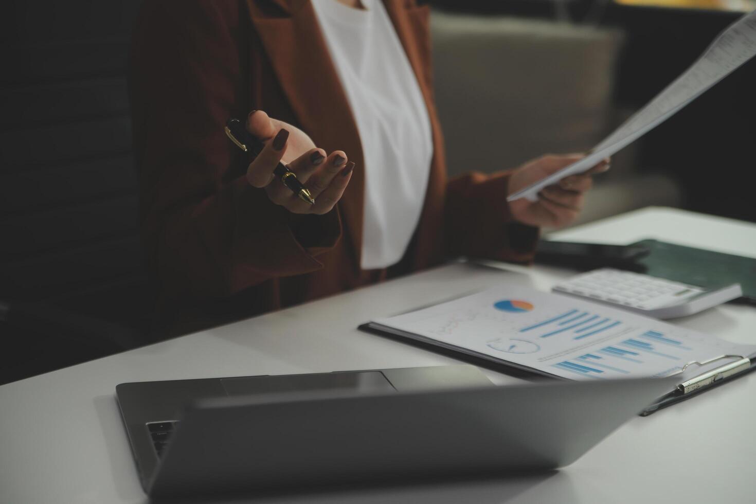 Business Documents, Auditor businesswoman checking searching document legal prepare paperwork or report for analysis TAX time,accountant Documents data contract partner deal in workplace office photo