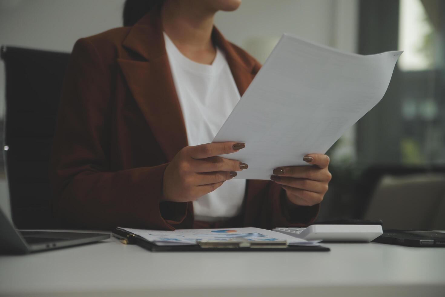 Business Documents, Auditor businesswoman checking searching document legal prepare paperwork or report for analysis TAX time,accountant Documents data contract partner deal in workplace office photo