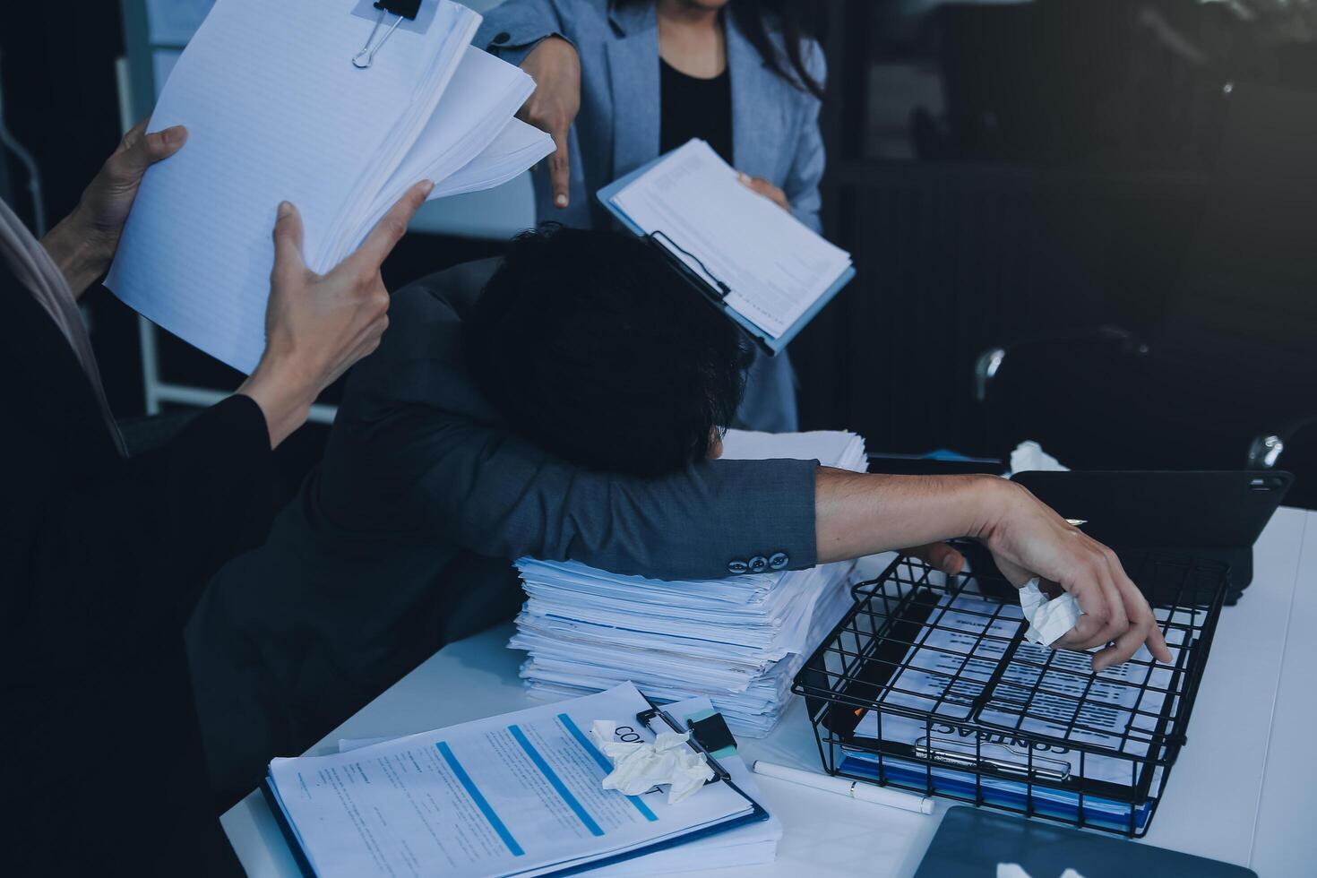 Stressful business man have so many paperwork in the office photo