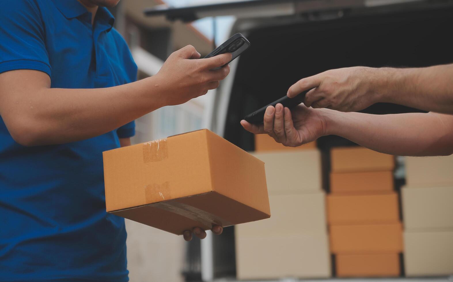 Asian delivery express courier young man use giving boxes to woman customer he wearing protective face mask at front home photo
