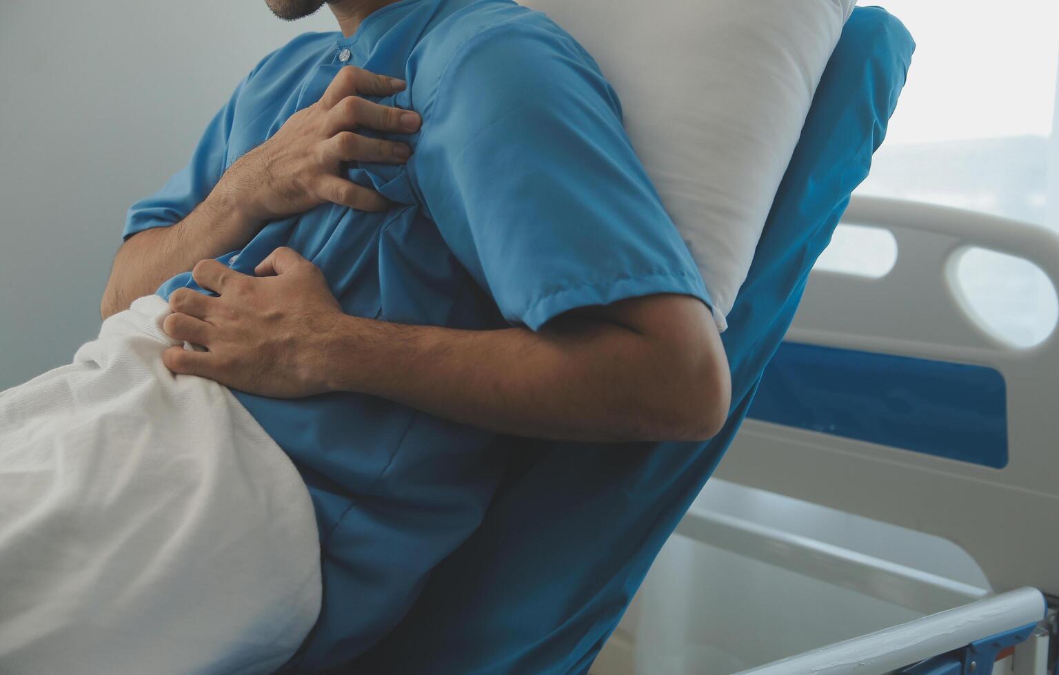 Male patient consulting a medical specialist at hospital. Chest pain and inflammatory heart disease photo