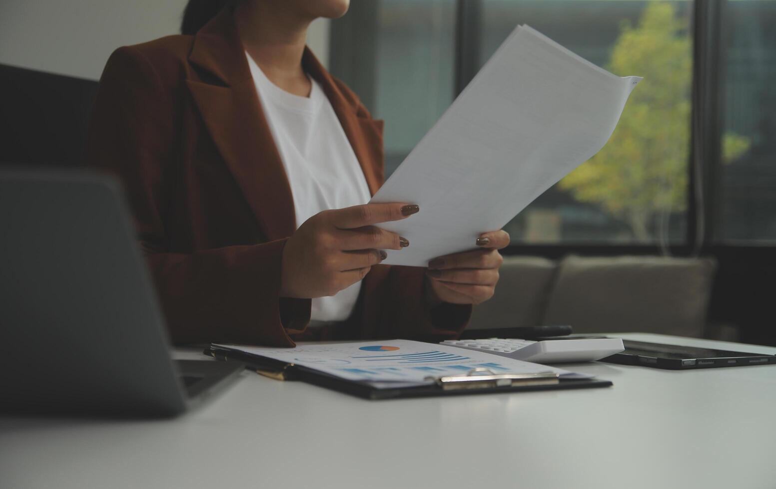 Business Documents, Auditor businesswoman checking searching document legal prepare paperwork or report for analysis TAX time,accountant Documents data contract partner deal in workplace office photo
