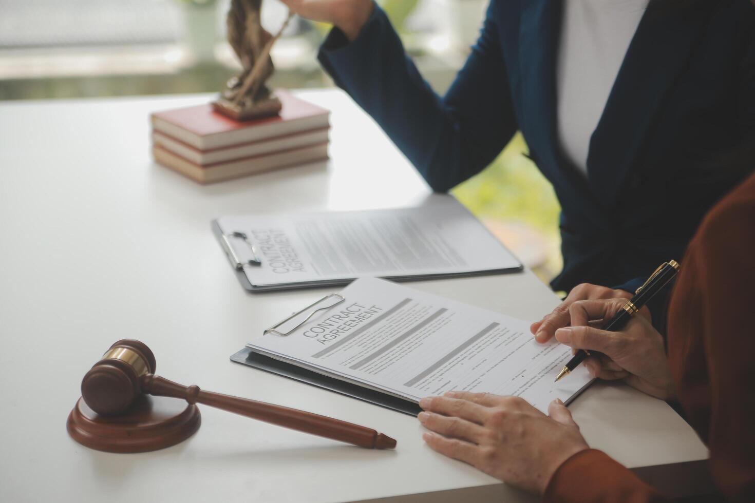 Lawyer, legal advisor, businessman brainstorming information on agreement details Business contracts in legal processing books for accuracy in contract documents. joint financial investment. photo
