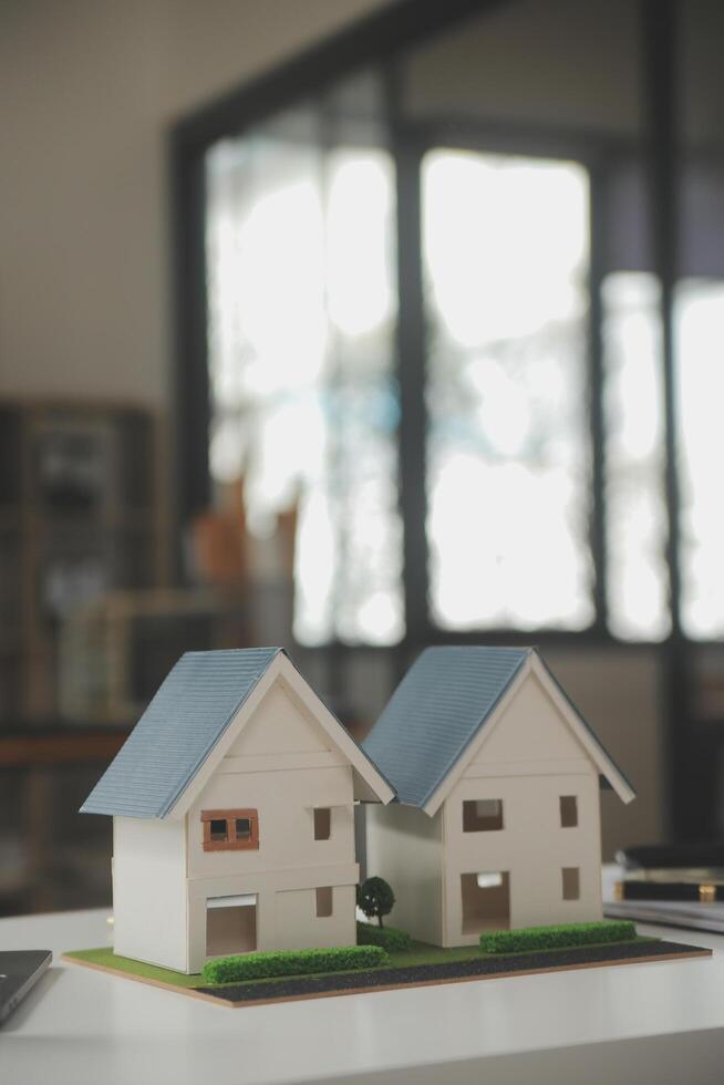 Business Signing a Contract Buy - sell house, insurance agent analyzing about home investment loan Real Estate concept. photo