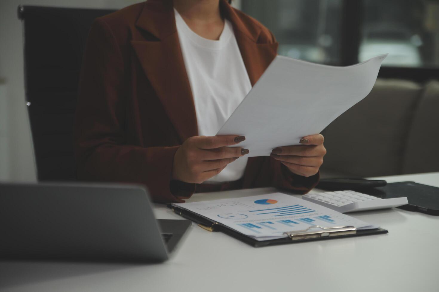Business Documents, Auditor businesswoman checking searching document legal prepare paperwork or report for analysis TAX time,accountant Documents data contract partner deal in workplace office photo
