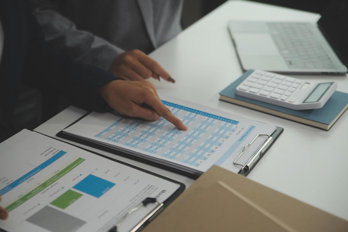 Team of business people working together in the meeting room office, teamwork background charts and graphs banner, double exposure successful teamwork,business planning concept. photo