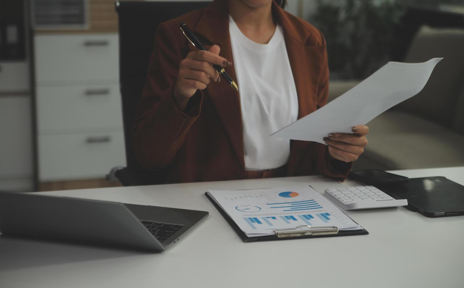 Business Documents, Auditor businesswoman checking searching document legal prepare paperwork or report for analysis TAX time,accountant Documents data contract partner deal in workplace office photo