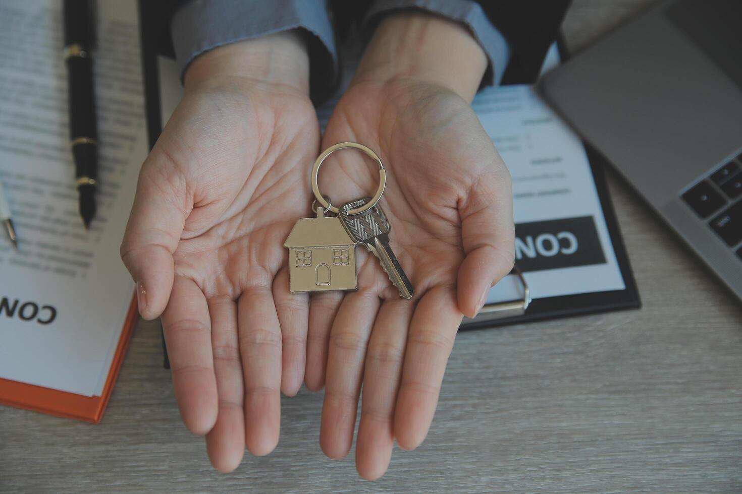 Real estate agent and customer signing contract to buy house, insurance or loan real estate.rent a house,get insurance or loan real estate or property. photo