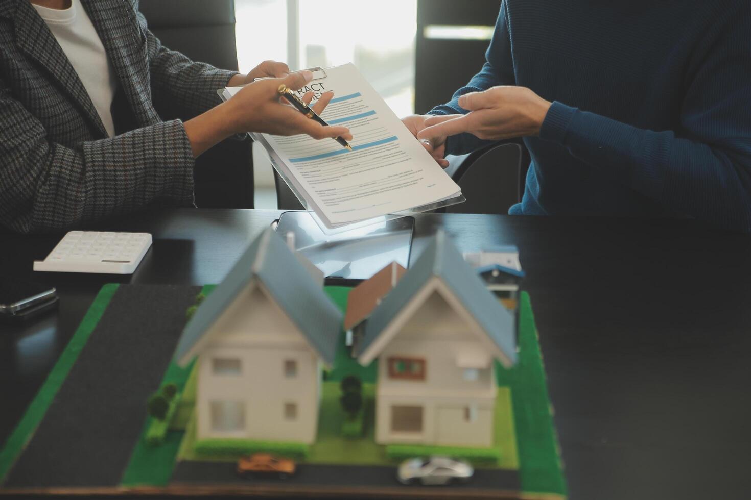 Team of architectures and businessmen discussing and brainstorming on floor plan modification for real estate investment and housing development project photo